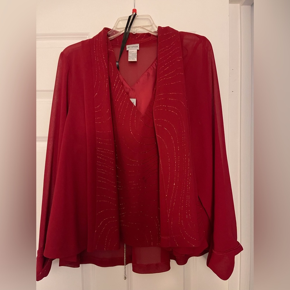 2 piece dress jacket with separate top. Polyester material. Only worn once.